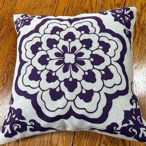 Square cream color 18” throw pillow.  Blue/purple design on one side.